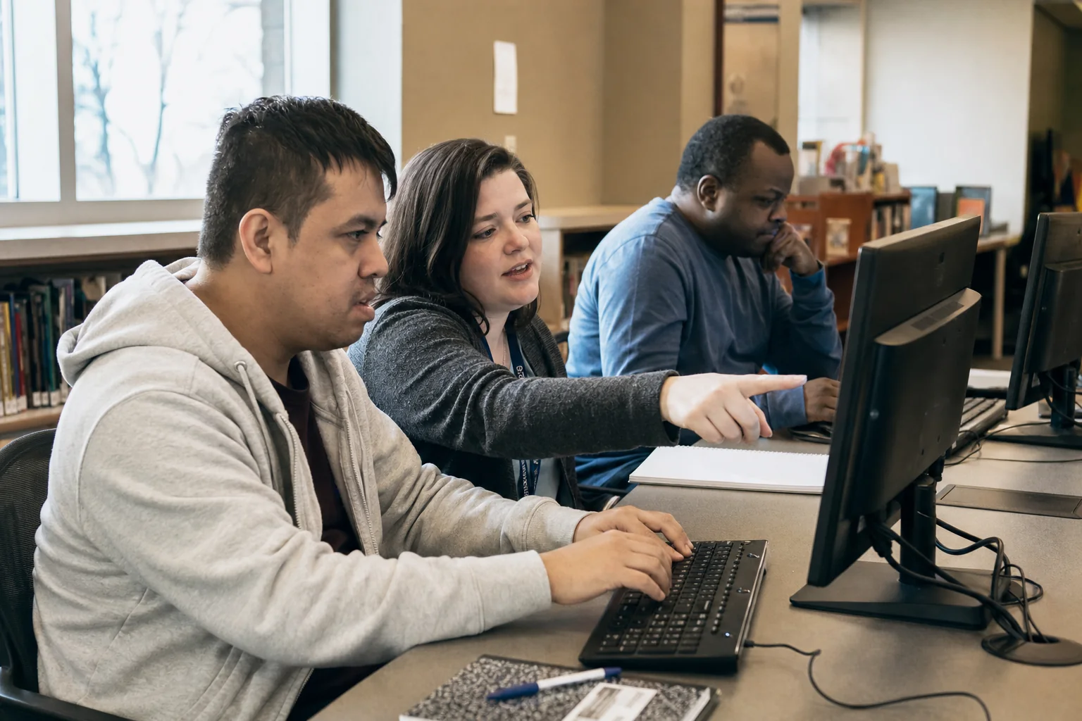 Participants developing computer and job-readiness skills with staff guidance